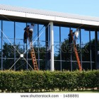stock-photo-two-window-cleaners-at-work-1488891