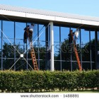 stock-photo-two-window-cleaners-at-work-1488891